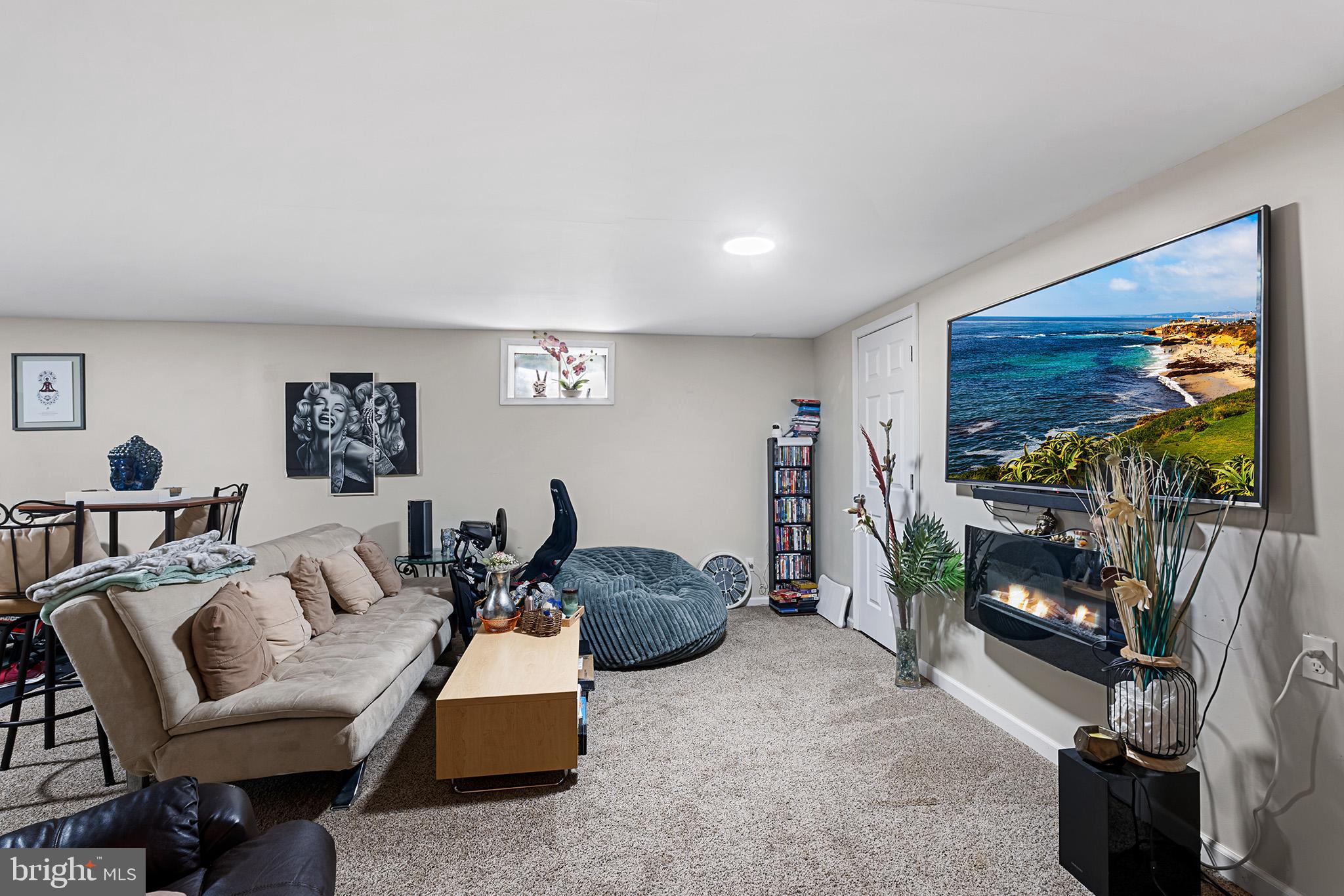 3808 Walnut Ridge Estate Pottstown, PA 19464 - Photo 23 of 30 a living room with furniture and a flat screen tv