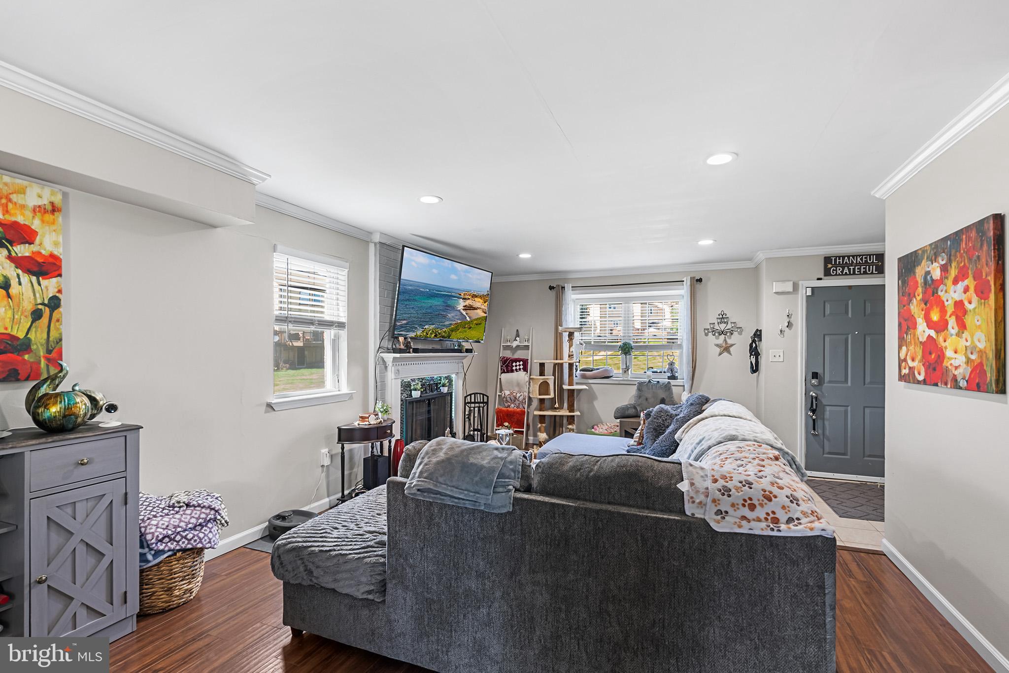3808 Walnut Ridge Estate Pottstown, PA 19464 - Photo 5 of 30 a living room with furniture a flat screen tv and a window