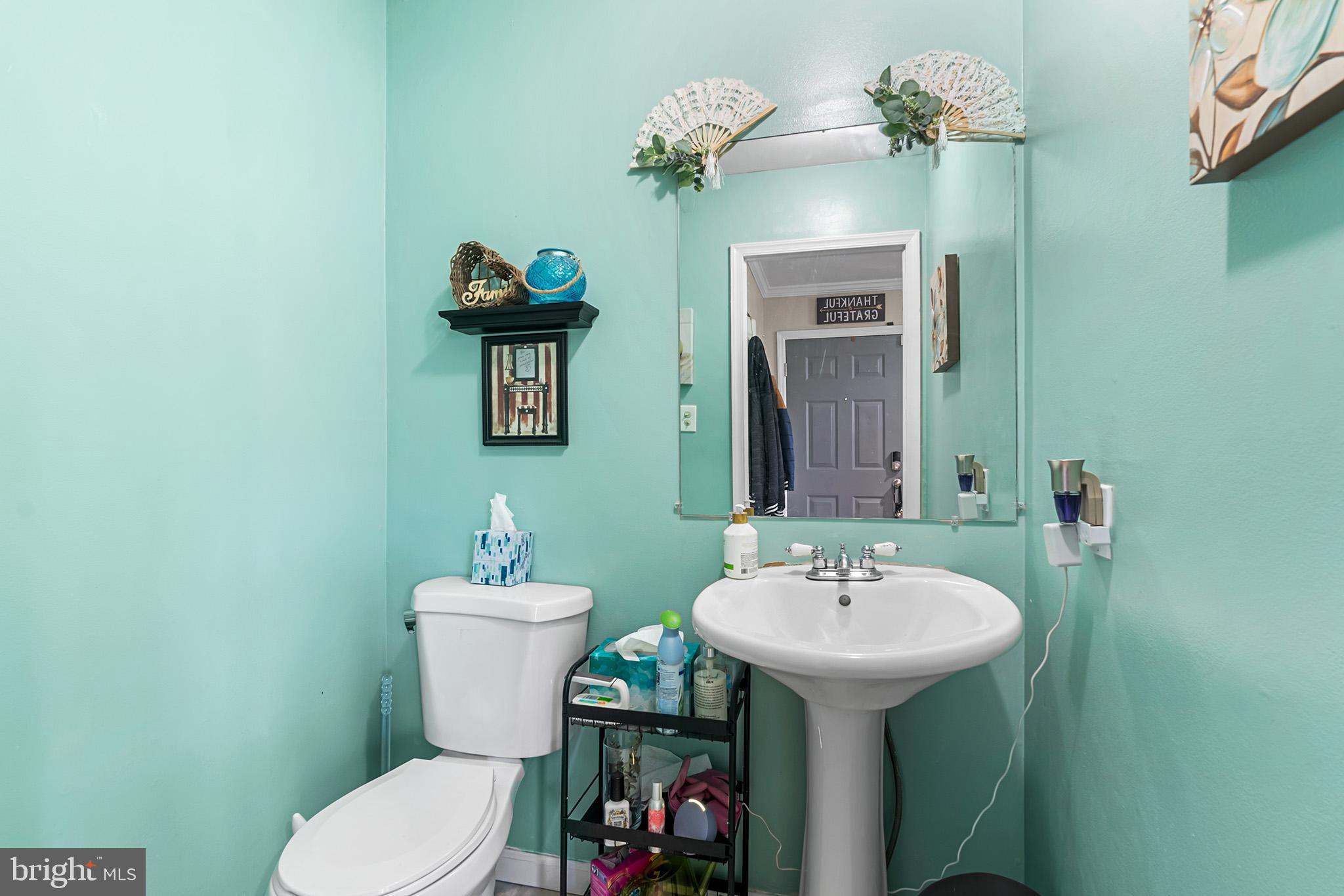 3808 Walnut Ridge Estate Pottstown, PA 19464 - Photo 7 of 30 a bathroom with a toilet sink and mirror