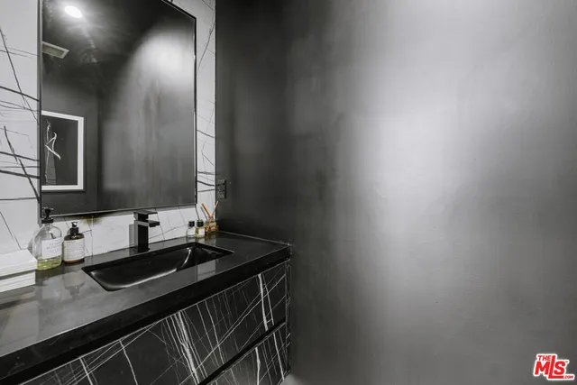 a view of a livingroom with workspace and a couch