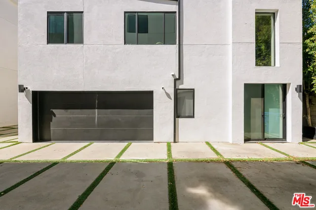 a kitchen with a sink a table and chairs