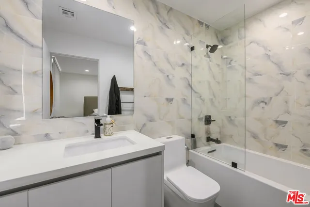 a view of a balcony with furniture