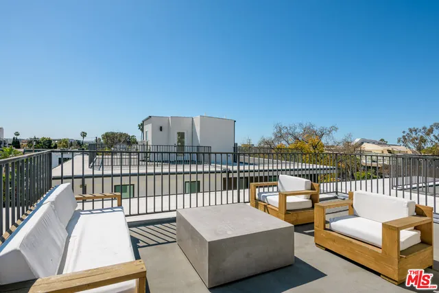 a view of a balcony with wooden floor