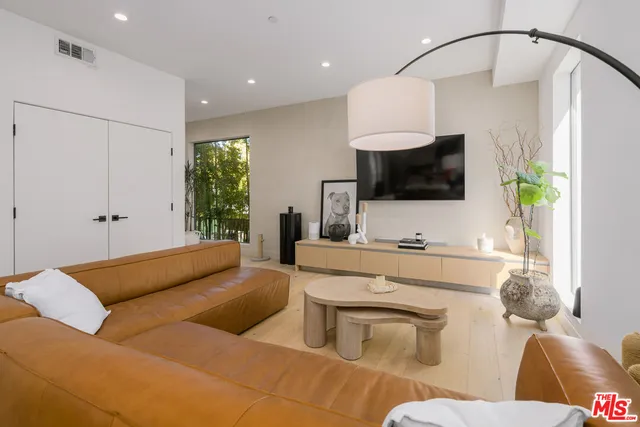 a living room with furniture and a table