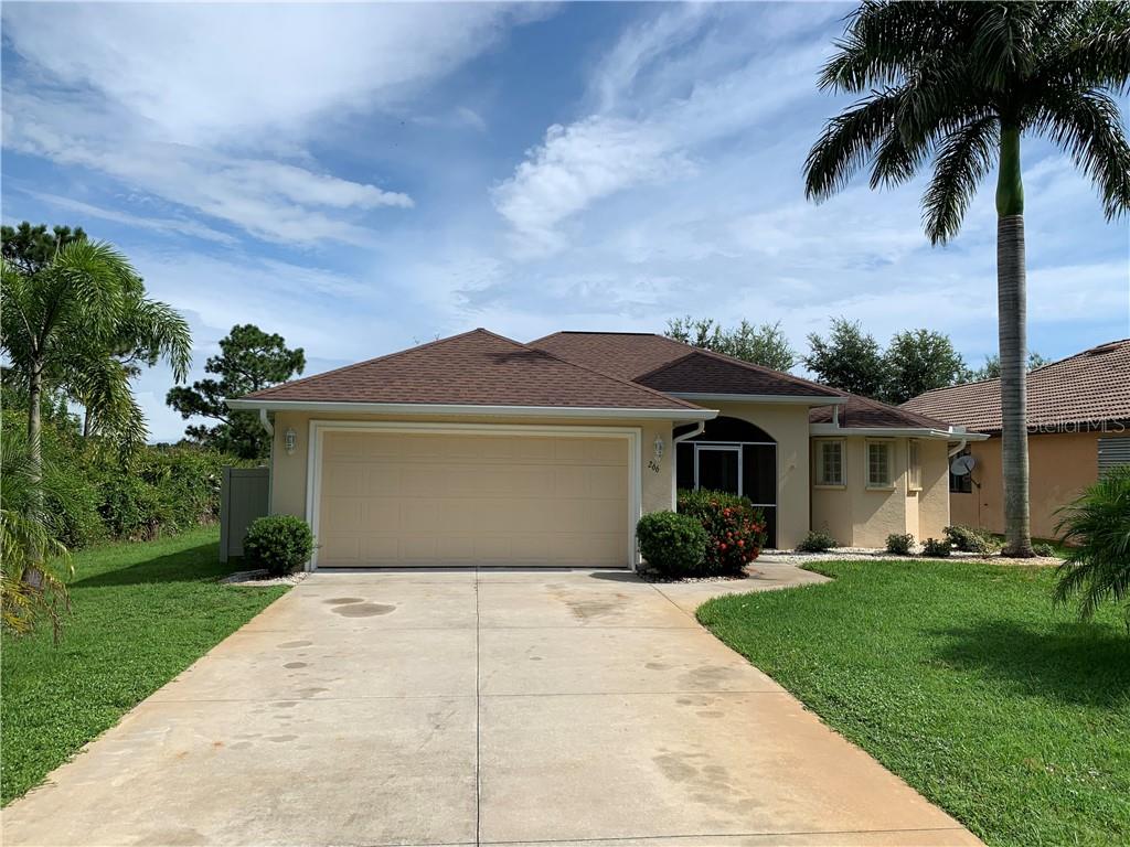 266 Albatross Road Rotonda West, FL 33947 - Photo 1 of 1 front view of a house with a yard