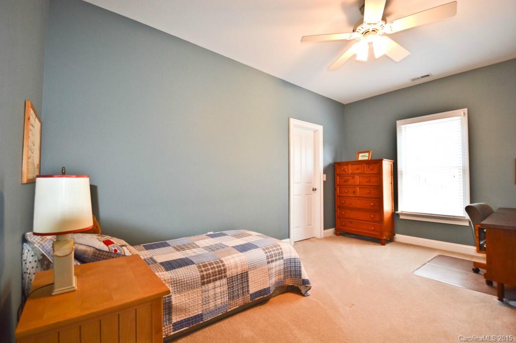 704 Shady Grove Crossing, Unit 496 Fort Mill, SC 29708 - Photo 16 of 20 a bedroom with bed and window