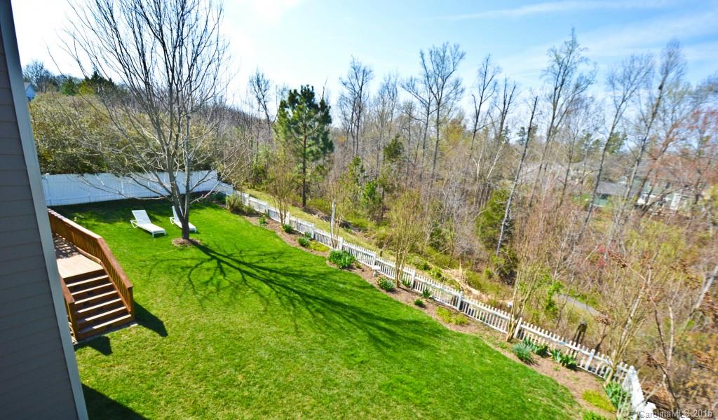 704 Shady Grove Crossing, Unit 496 Fort Mill, SC 29708 - Photo 19 of 20 a green field with lots of trees in it