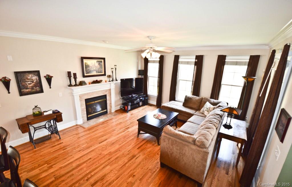 704 Shady Grove Crossing, Unit 496 Fort Mill, SC 29708 - Photo 6 of 20 a living room with furniture and a fireplace