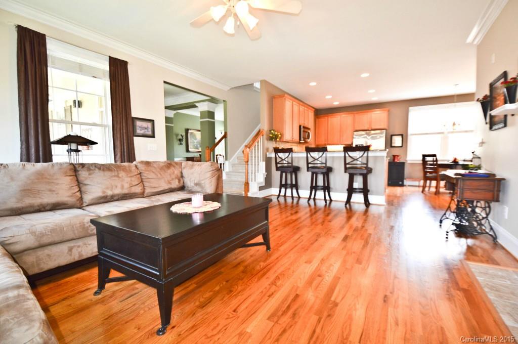 704 Shady Grove Crossing, Unit 496 Fort Mill, SC 29708 - Photo 7 of 20 a living room with furniture and wooden floor
