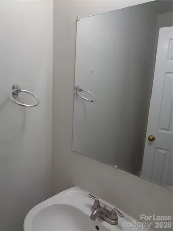 a bathroom with a sink and vanity