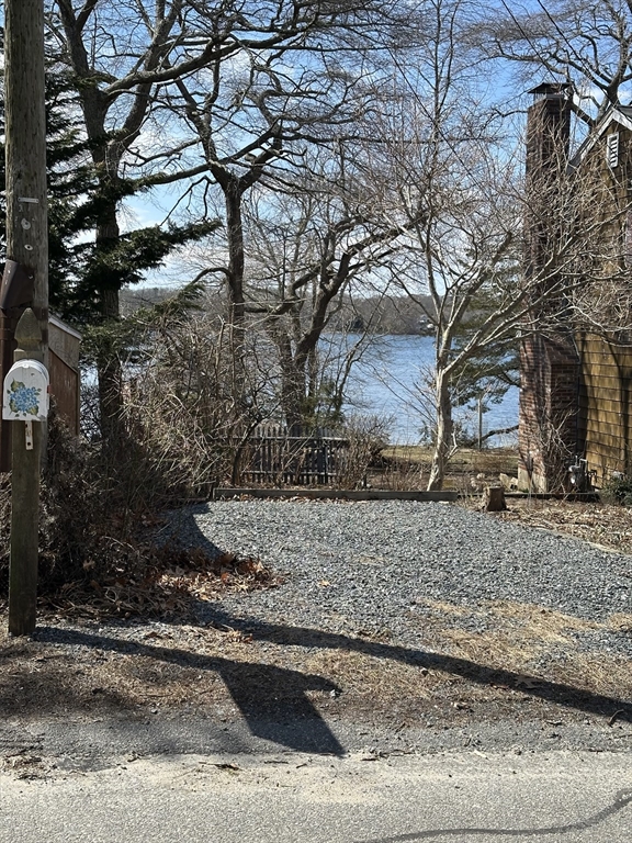163 Ninigret Avenue Mashpee, MA 02649 - Photo 17 of 17 a view of a backyard of the house