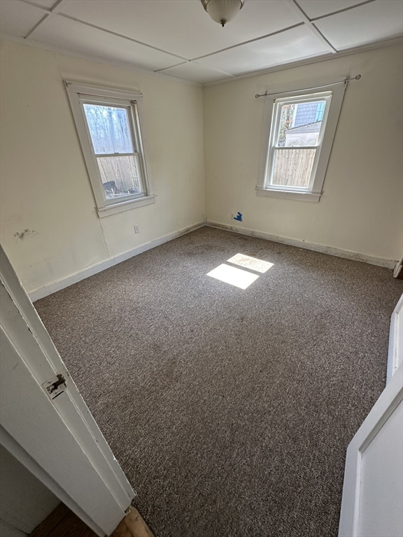 163 Ninigret Avenue Mashpee, MA 02649 - Photo 4 of 17 an empty room with windows