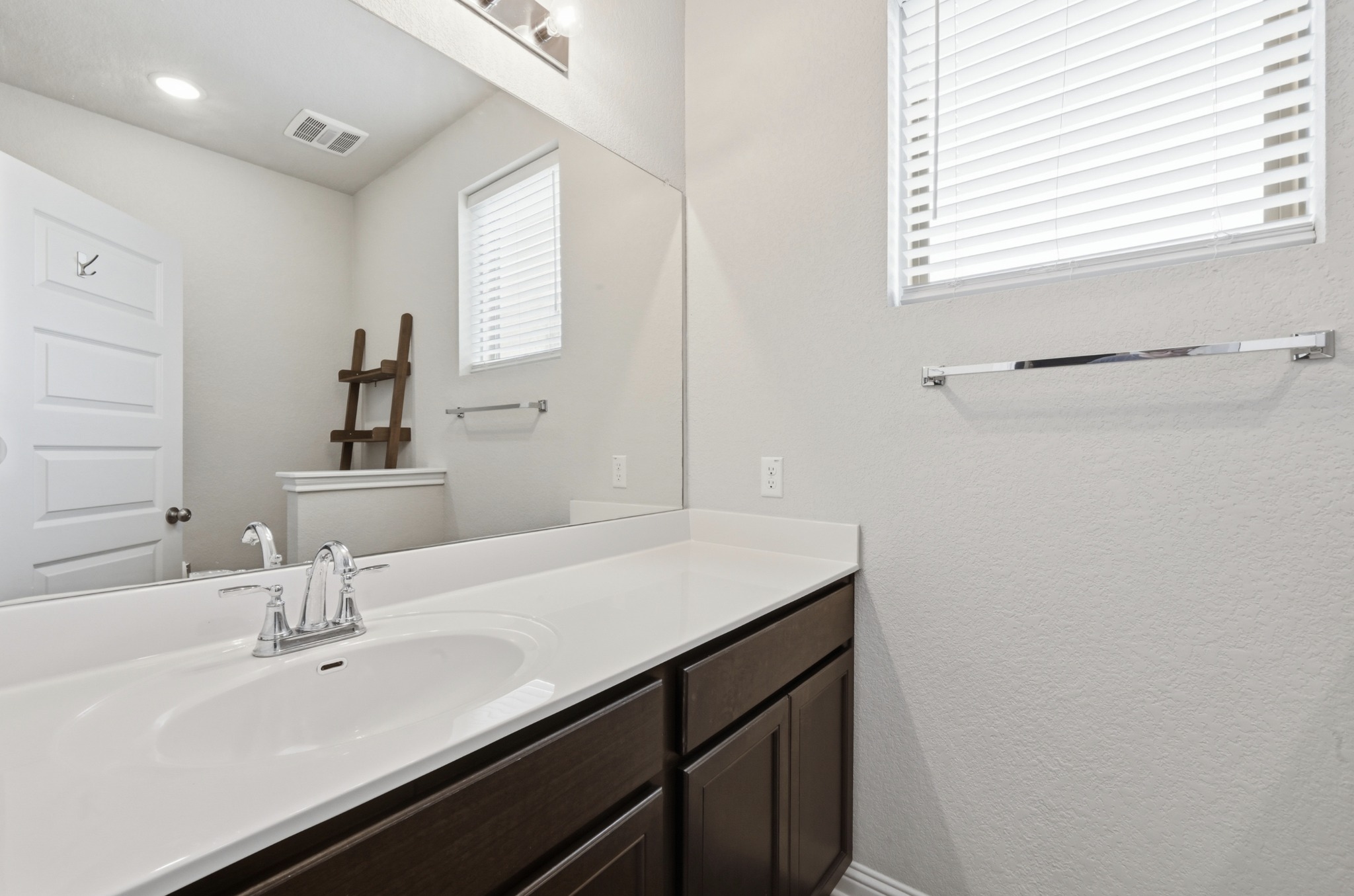 8201 Frida Bend Austin, TX 78744 - Photo 21 of 29 A well-appointed vanity with generous counter space, perfect for daily routines.