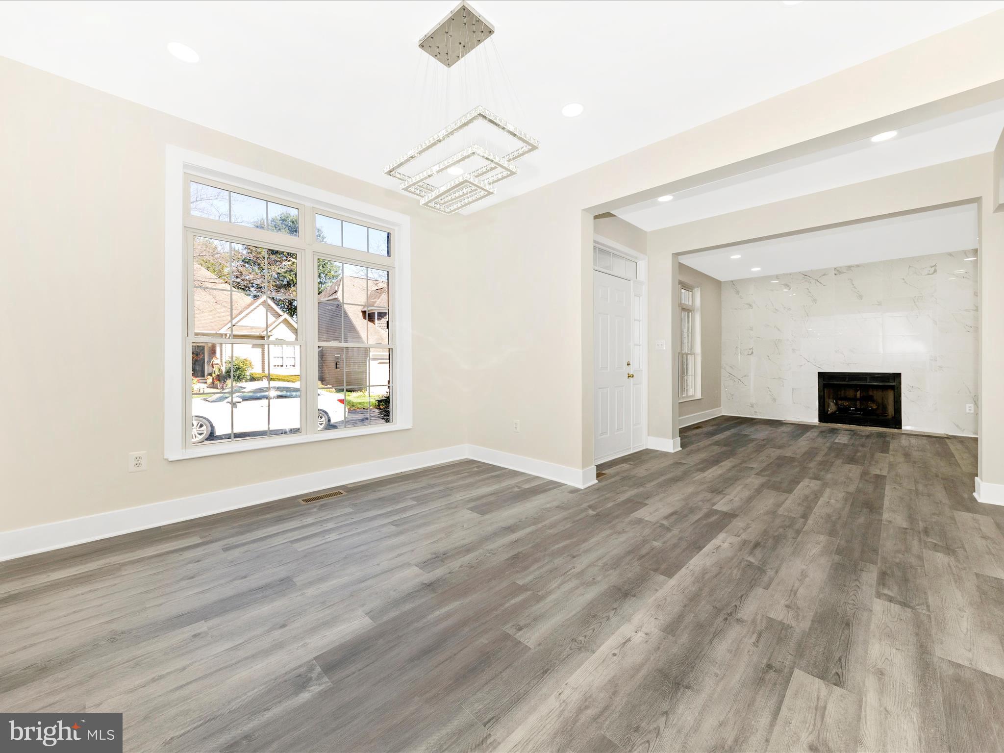 2621 Bear Den Road Frederick, MD 21701 - Photo 15 of 77 a view of empty room with wooden floor and fan
