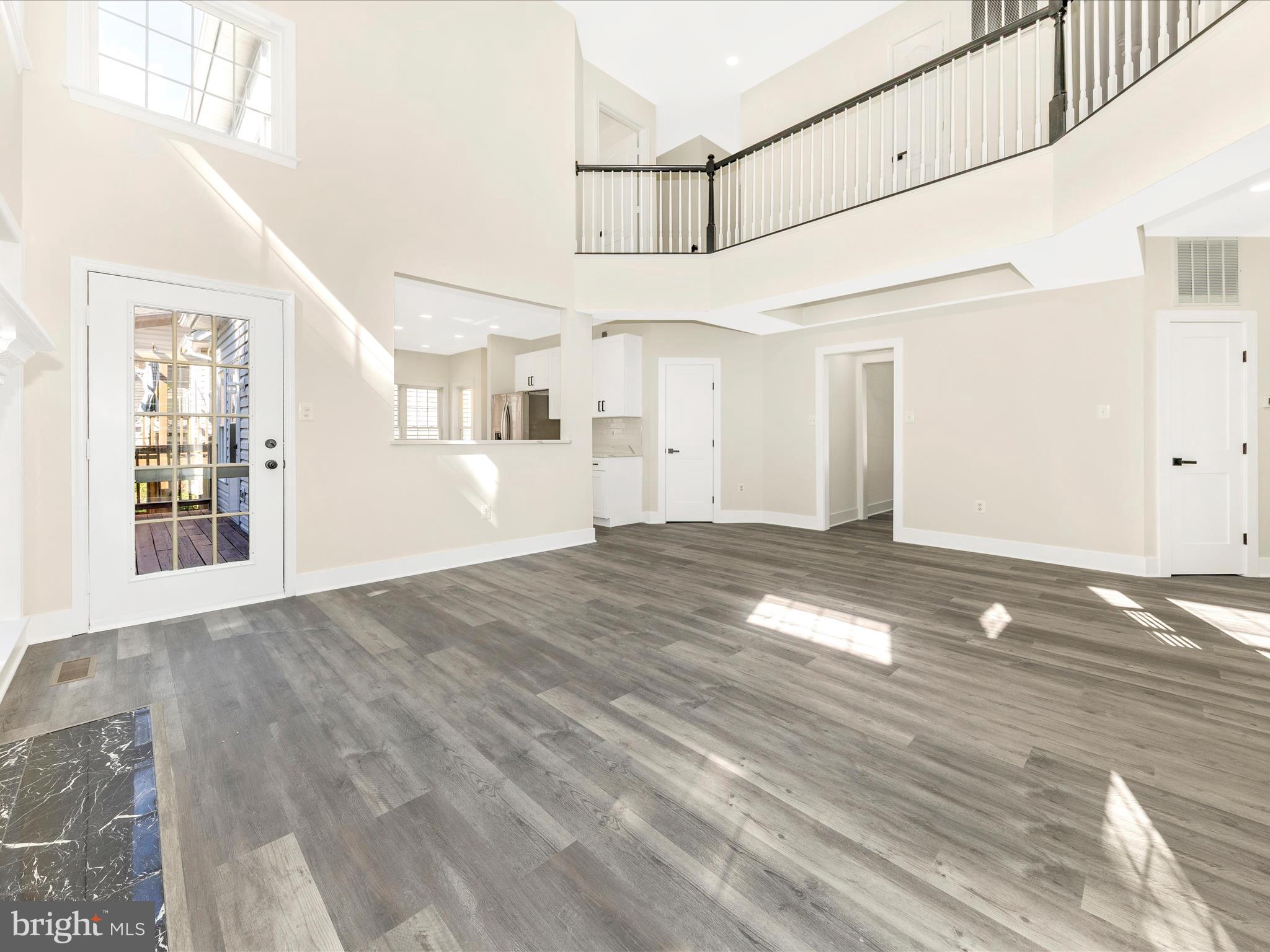 2621 Bear Den Road Frederick, MD 21701 - Photo 19 of 77 a view of empty room with wooden floor