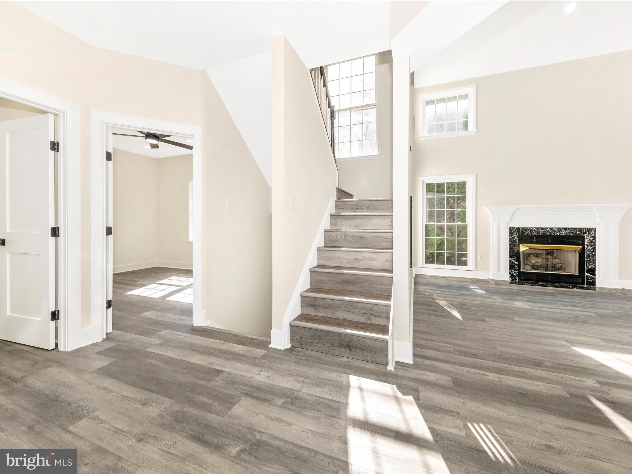 2621 Bear Den Road Frederick, MD 21701 - Photo 29 of 77 a view of a livingroom with wooden floor and stairs