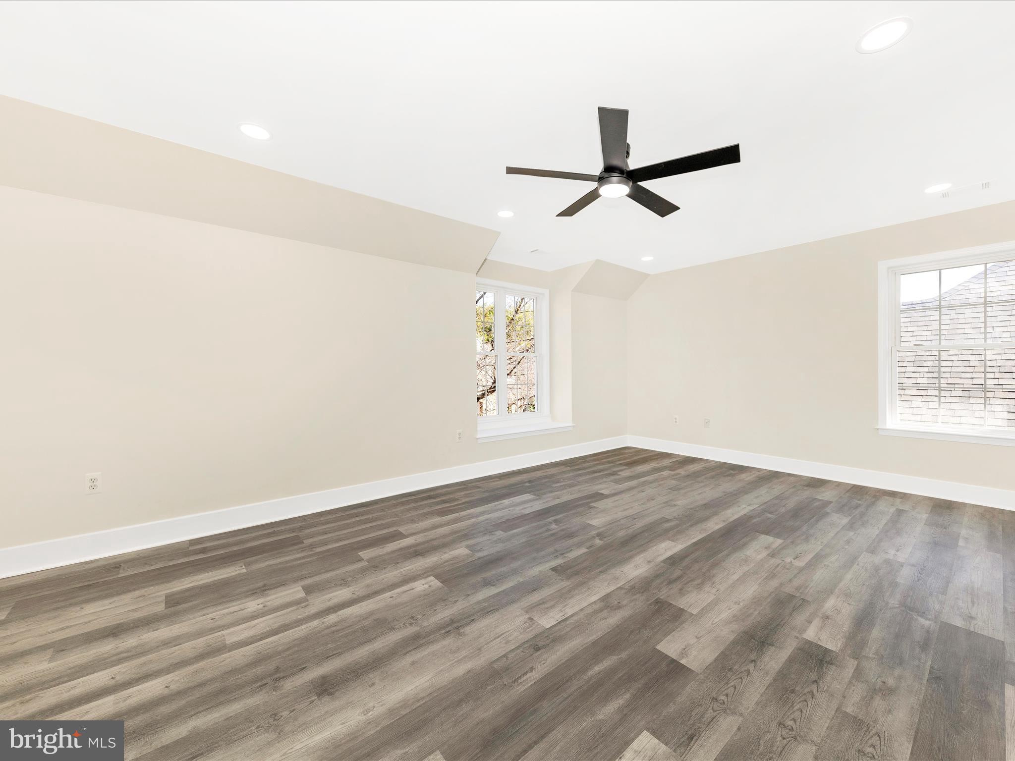 2621 Bear Den Road Frederick, MD 21701 - Photo 31 of 77 an empty room with wooden floor and windows