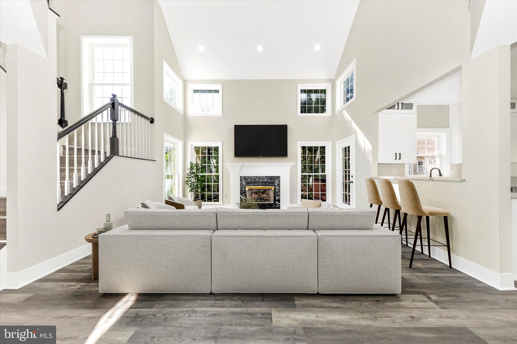 2621 Bear Den Road Frederick, MD 21701 - Photo 4 of 77 a living room with fireplace furniture and a flat screen tv