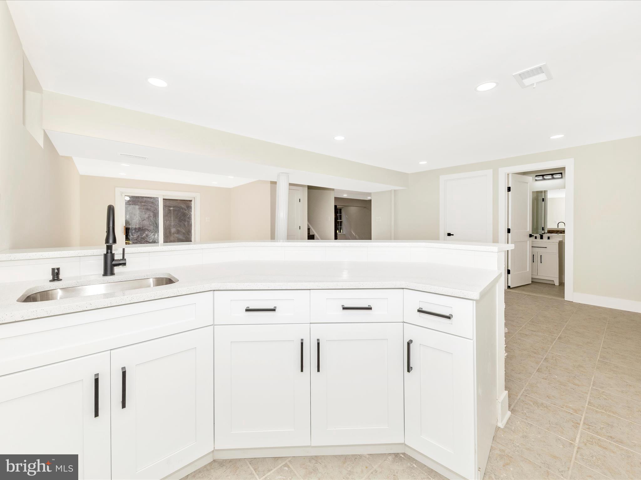 2621 Bear Den Road Frederick, MD 21701 - Photo 44 of 77 a spacious bathroom with a double vanity sink and a mirror
