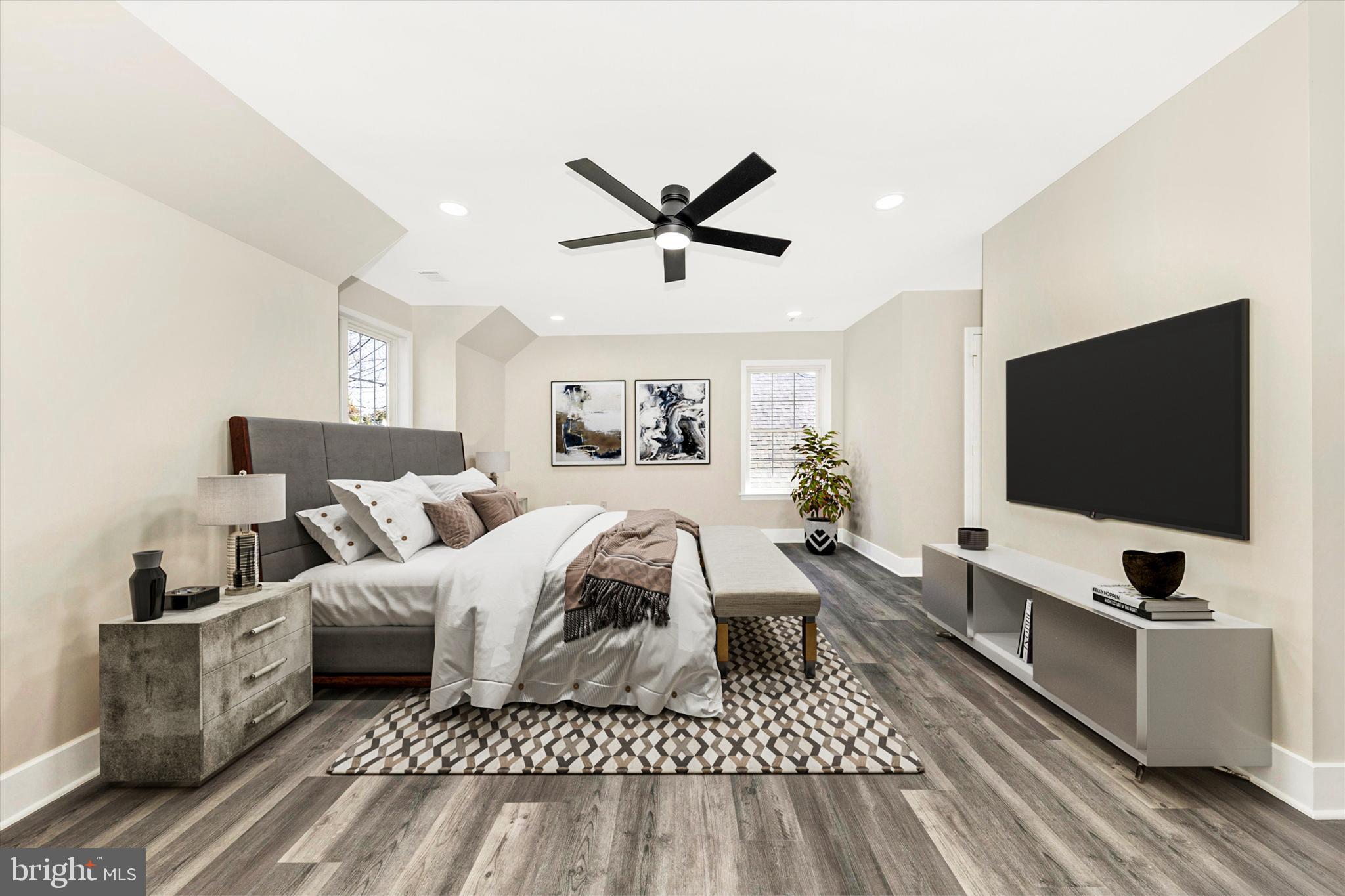 2621 Bear Den Road Frederick, MD 21701 - Photo 7 of 77 a spacious bedroom with a bed and a flat screen tv