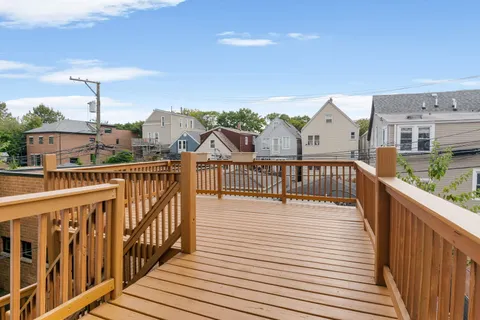 a view of balcony with furniture