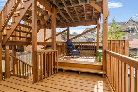 a view of a balcony with car parked