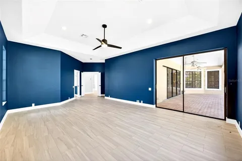 a bedroom with a large bed and a large window