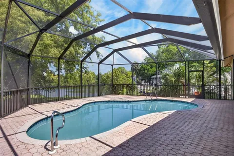 a view of a swimming pool with a patio