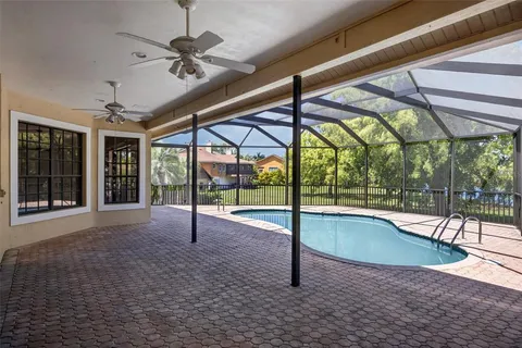 a view of a swimming pool with a porch