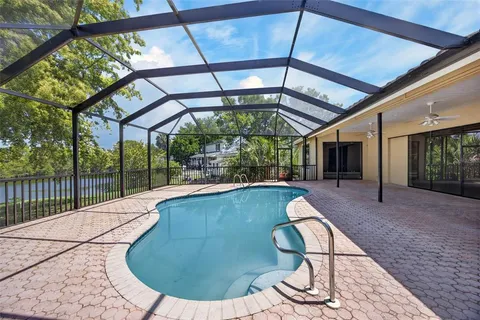 a view of outdoor space with swimming pool and sitting space