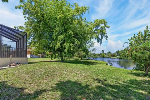 a view of a lake with houses in the back
