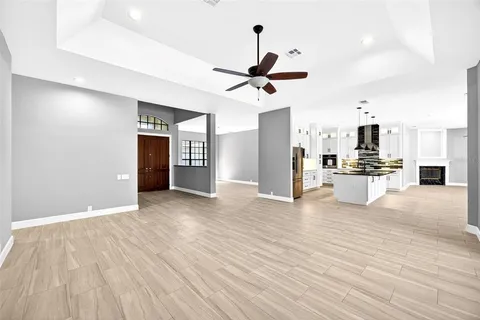 a view of a kitchen with a sink and a refrigerator