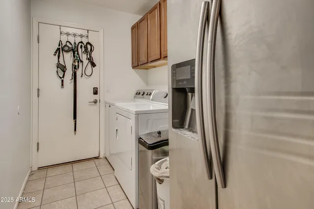 a living room with furniture a ceiling fan and a window