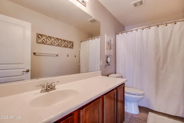 a view of a house with outdoor seating and a garage
