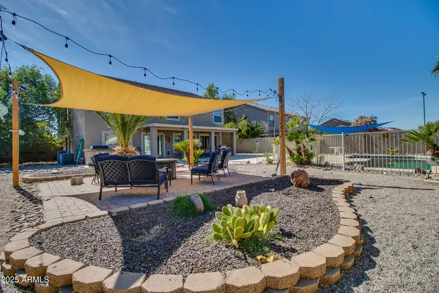 a swimming pool view with a garden space
