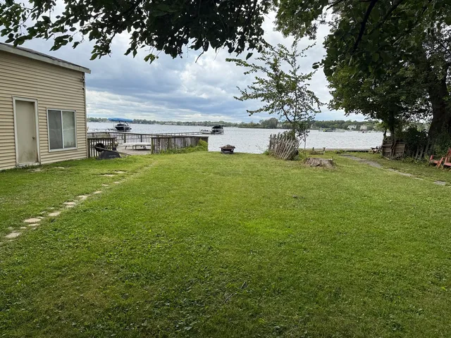 a view of a house with a back yard