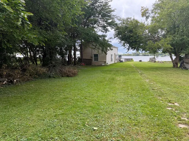 a view of a house with a big yard