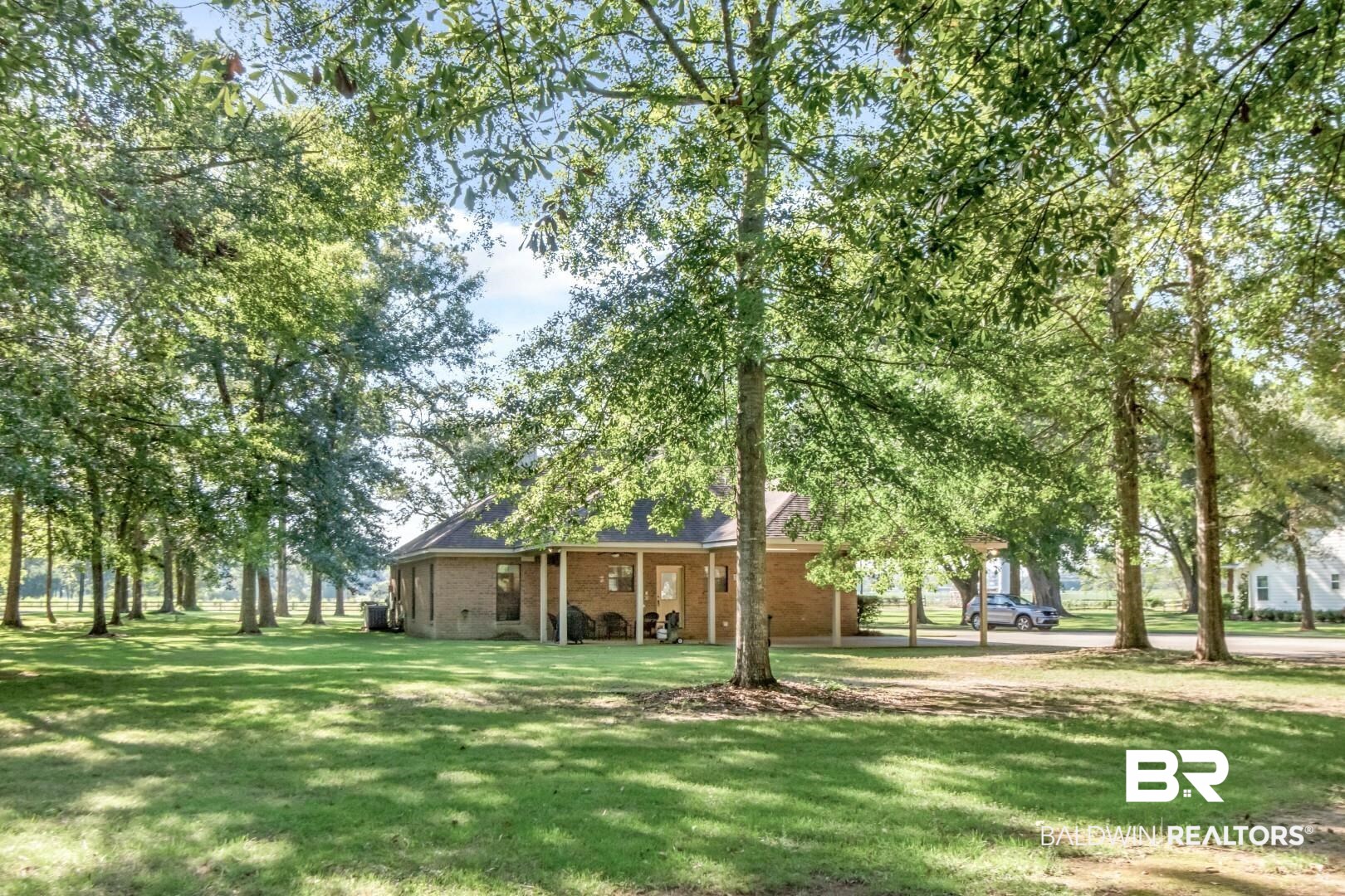 1360 Dykes Road North Mobile, AL 36608 - Photo 33 of 40 View of grassy yard with an attached carport