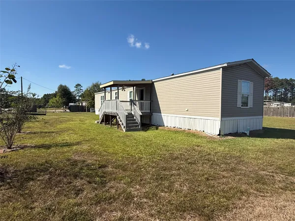 a view of swimming pool with a yard
