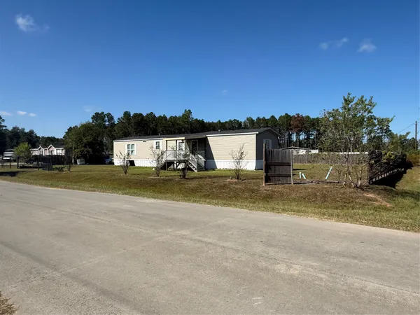 a view of balcony with wooden floor