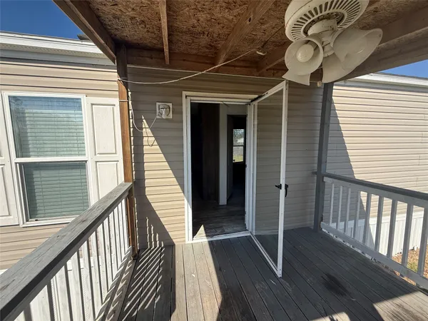 a view of an empty room with a fireplace