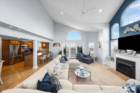 a living room with furniture fireplace and flat screen tv