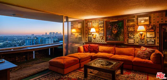 a blue bench sitting in front of a building