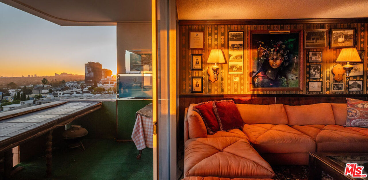 8787 Shoreham Drive, Unit 607 West Hollywood, CA 90069 - Photo 20 of 25 a blue couch sitting in front of a building