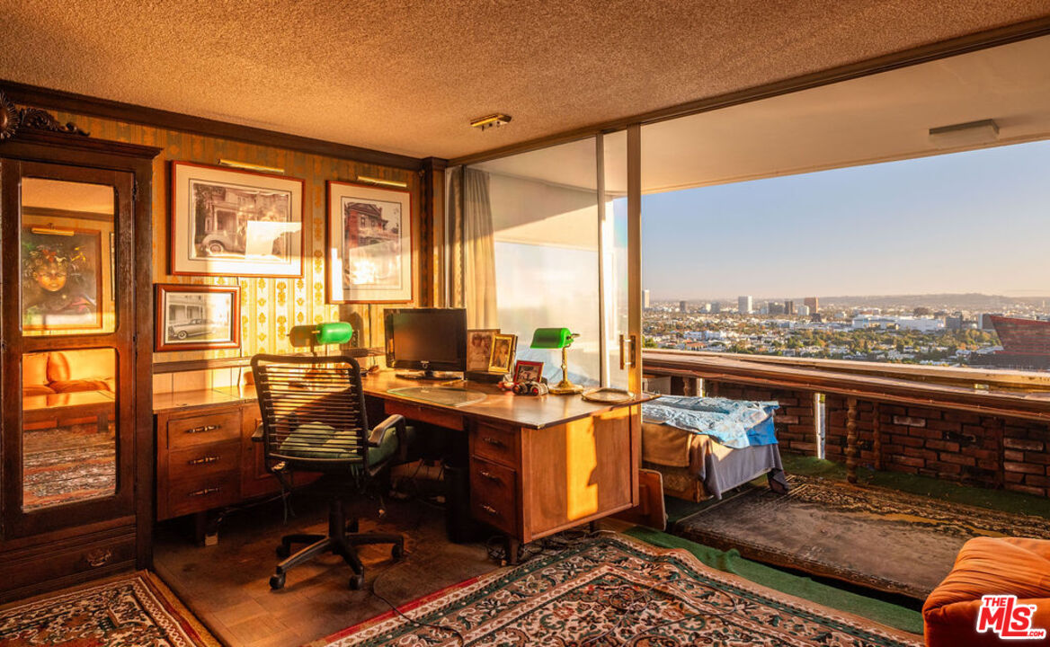 8787 Shoreham Drive, Unit 607 West Hollywood, CA 90069 - Photo 3 of 25 a view of a workspace with furniture and lounge chair