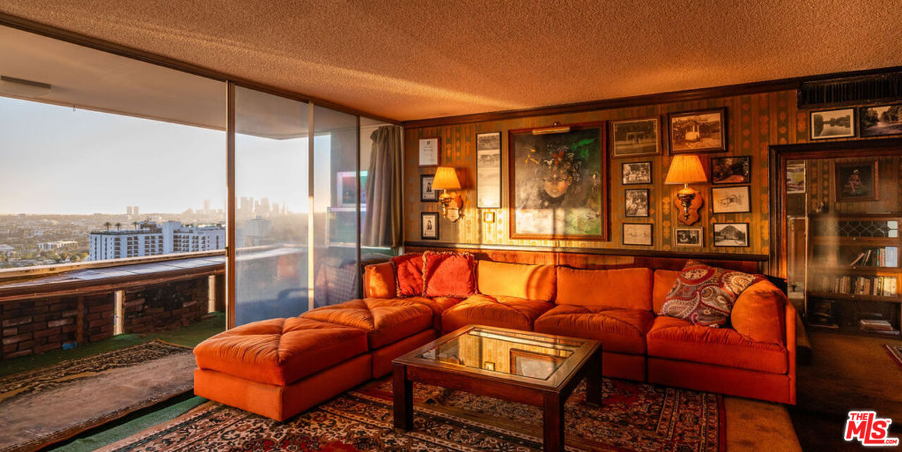 8787 Shoreham Drive, Unit 607 West Hollywood, CA 90069 - Photo 4 of 25 a blue chair sitting in front of a building