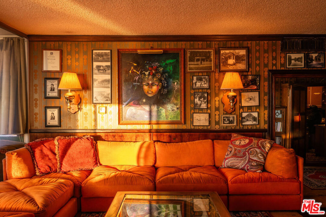 8787 Shoreham Drive, Unit 607 West Hollywood, CA 90069 - Photo 5 of 25 a blue couch sitting in front of a building