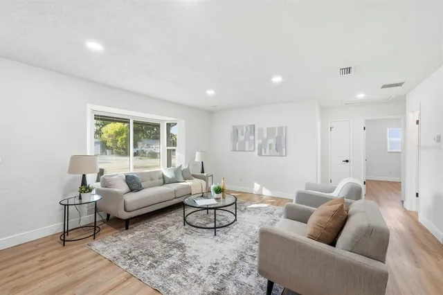 a living room with furniture and a window