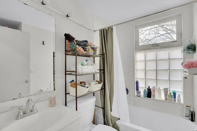 a bathroom with a bathtub and a sink