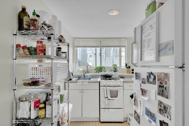 a view of cabinets a washer and dryer